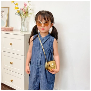 Girl's denim romper paired with a gold crocodile texture mini crossbody flap bag