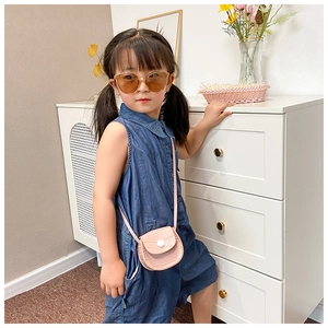 Pink crocodile pattern toddler crossbody bag with decorative white button detail