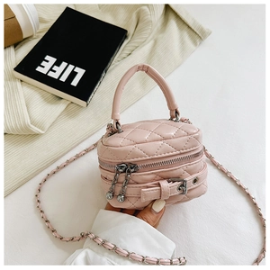 Pink quilted mini handbag for kids with metal chain strap and top handle details