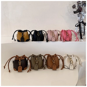 Collection of mini drawstring bucket bags in eight colors with lychee texture