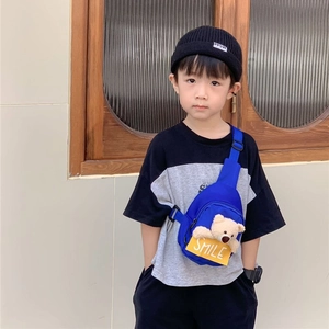 Cute blue nylon kids crossbody chest bag featuring a plush bear charm and smile detail