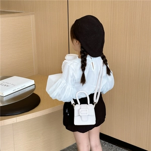 Kids minimalist white litchi pattern saddle bag with round handle and top buckle
