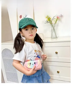 Detail of cute cat crossbody bag for girls featuring rainbow sequin flap and pink faux leather