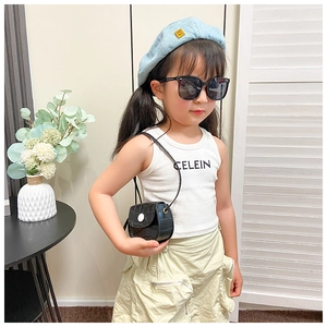 Detailed view of kids crocodile texture mini crossbody bag with sunglasses and beret hat