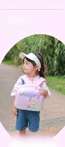 Detail of pink cartoon castle backpack with ergonomic S-straps for toddlers