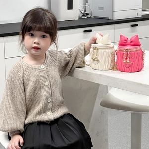Mini girls bucket bag with bow detail, matelassé texture and gold chain strap