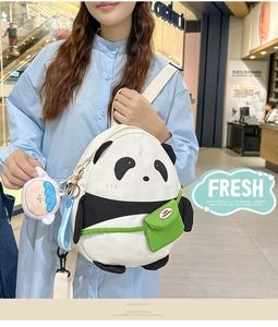 Detail of cute panda backpack with green mini pouch and plush character charm