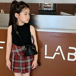 Fashionable girls' sleeveless top with plaid skirt and black mini crossbody basket bag