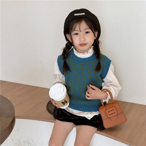 Kids vintage argyle knit vest in blue and green with a retro horseshoe buckle saddle bag