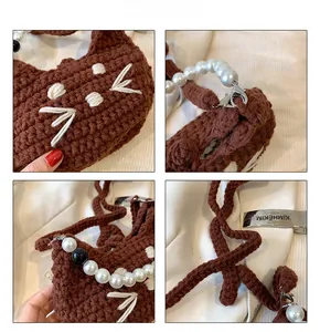 Close-up of brown crochet cat bag with pearl handle and metal KIMHEKIM logo plate