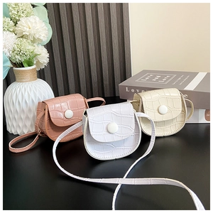 Close-up of pink, white, and beige mini crocodile pattern PU crossbody bags for girls