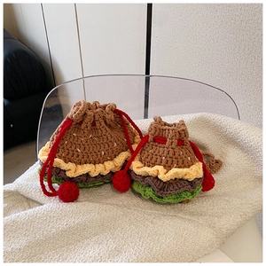 Close-up of handmade crochet hamburger drawstring bags in two sizes for children