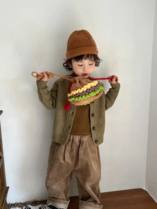 Detail of a handmade crochet hamburger drawstring bucket bag for kids with textured layers