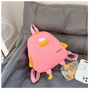 Detailed close-up of a pink cartoon duck backpack with yellow wings and 3D feet