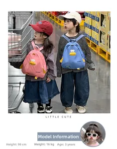 Detailed view of cute cartoon chick backpacks in pink and blue for toddlers and children
