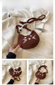 Detail of brown crochet cat bag with pearl handle and knit shoulder strap for girls