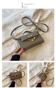 Detail of light coffee lychee leather girl bag with golden metallic twist lock buckle
