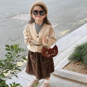 Child fashion knit cardigan with a cute brown crochet cat-shaped crossbody bag accessory