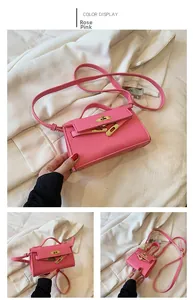Rose pink mini girls handbag with litchi grain texture and gold twist lock detail