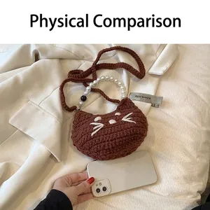 Brown crochet cat-shaped mini bag with white pearl handle and long knit shoulder strap