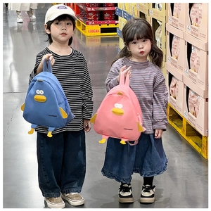 Detail of cute cartoon chicken backpacks in pink and blue for kids with 3D wing features