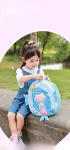 Detailed close-up of a blue mermaid hard shell backpack for girls with 3D embossed fins