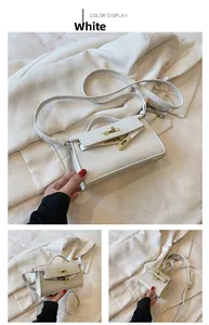 Detail of white litchi pattern leather girl handbag with gold twist lock and strap