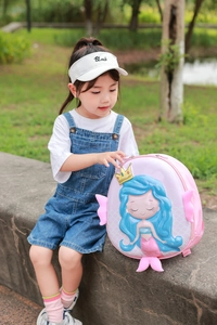 Pink hard shell mermaid backpack for kids featuring 3D relief and decorative fins