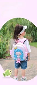Detail of pink mermaid hardshell toddler backpack with 3D fins and golden crown