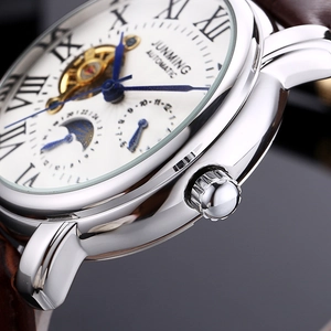 Men's automatic mechanical watch with moon phase and brown leather strap seen from side