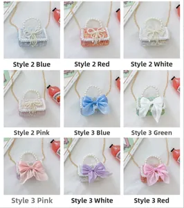 Detail view of multi-color mini tweed crossbody bags with pearl handles and bows