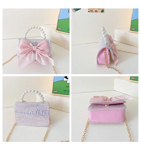 Detail view of pink sequin tweed girl's bag with large bow and pearl handle