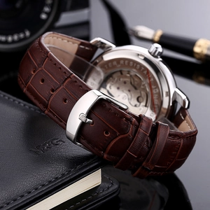 Automatic mechanical business watch with brown leather strap and transparent exhibition case back