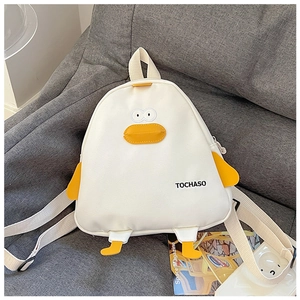 Detailed close-up of white canvas duck backpack with yellow 3D wings and embroidery