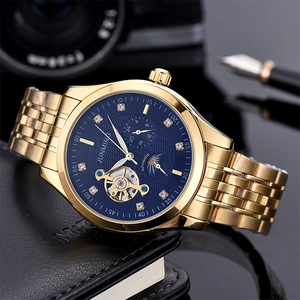 Detail of blue sunray dial with gold flying tourbillon and moon phase display