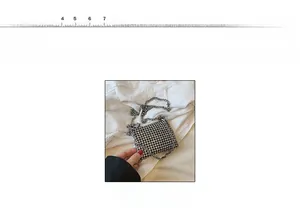 Detail view of mini square rhinestone chain bag with measurements on a 0-20cm scale