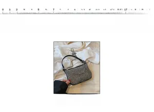 Detail view of a silver rhinestone half-moon handbag with a black handle and chain strap