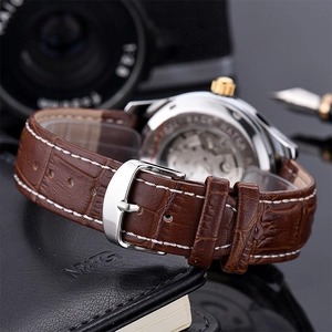 Macro view of leather strap and transparent case back showing automatic movement