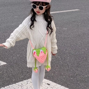 Pink handmade crochet strawberry shoulder bag for kids with green leaf details