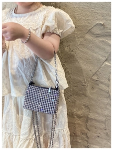 Mini rhinestone handbag for girls with sparkling silver crystals and a metal chain strap