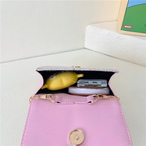 Pink glitter crossbody bag for girls featuring a gold chain strap and pearl handle