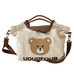 White canvas tote bag for girls featuring cute brown bear embroidery and leather strap