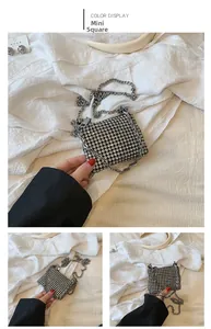 Detailed macro view of girls' mini square bag with silver rhinestones and chain strap