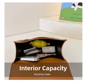 Internal capacity of retro PU leather kids backpack showing storage for phone and notebook