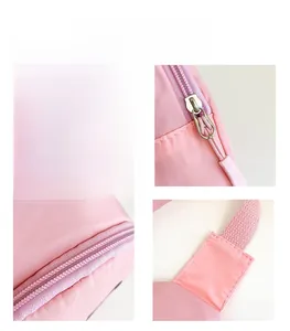 Detail shots of pink kids' canvas chest bag featuring silver zippers and logo print