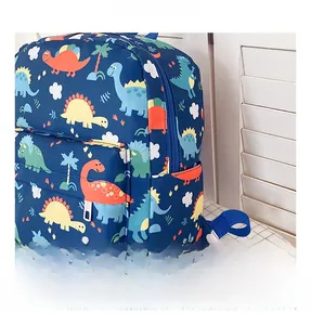 Detail of durable polyester fabric and colorful dinosaur prints on kids backpack