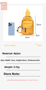 Close-up of yellow nylon kids sling bag with FASHION lettering and blue zipper detail