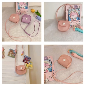 Detail of pink and purple mini PU leather crossbody bags with cute snap closure