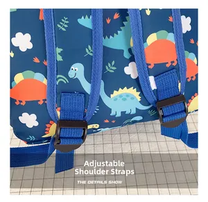 Close-up of adjustable blue nylon shoulder strap on children dinosaur cartoon backpack