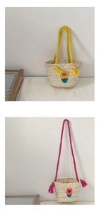 Detail of handmade straw bucket bags with colorful rope handles and floral patterns